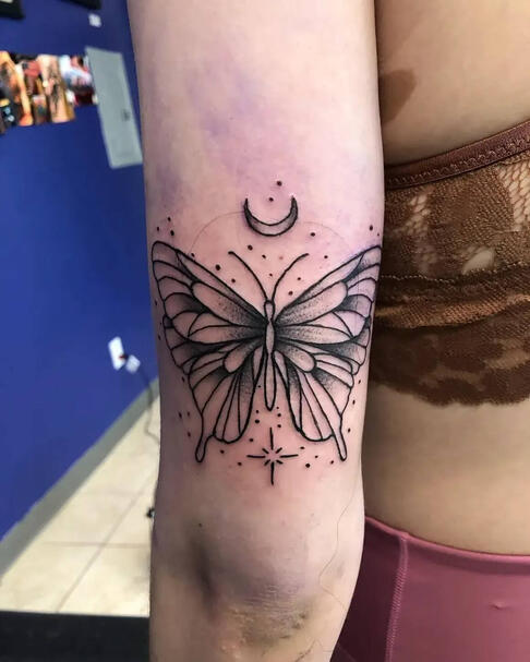 Butterfly on arm tattoo